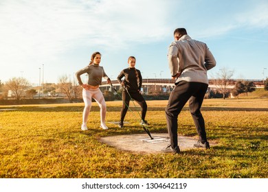 Personal trainer training two girls outdoor - Powered by Shutterstock