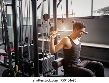 Personal trainer weight-lifting in fitness center - Powered by Shutterstock