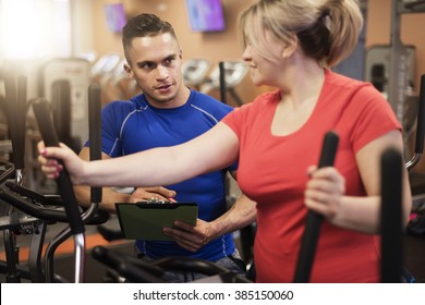 Personal Trainer Working With Woman With Overweight