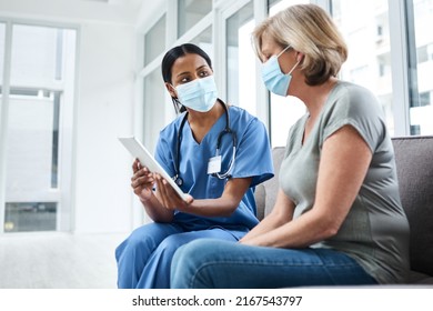 Personal Treatment Plans Tailored To Every Patient. Shot Of A Young Doctor Using A Digital Tablet During A Consultation With A Senior Woman.