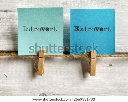 Personality concept - Introvert extrovert text on notepaper background. Stock photo.