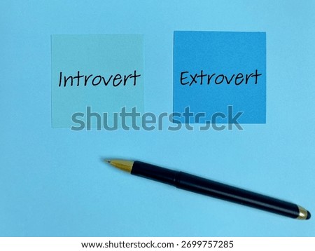 Personality types concept - Introvert extrovert text on notepaper background. Stock photo.