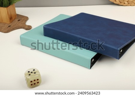 Personalized binding, leather folder cover, leather binding, binder, binder, office binding, corporate gift. Concept shot leather binding, top view, colorful