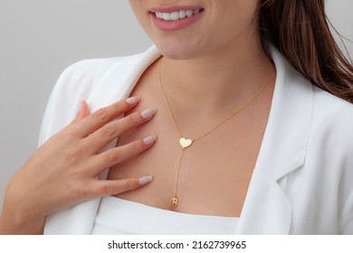 Personalized Silver Necklace On A Female Model Wearing A White Dress. Image For Ecommerce, Online Selling, Social Media, Jewelry Sale.