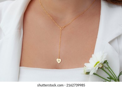 Personalized Silver Necklace On A Female Model Wearing A White Dress. Image For Ecommerce, Online Selling, Social Media, Jewelry Sale.