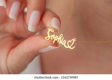Personalized silver necklace on a female model wearing a white dress. Image for ecommerce, online selling, social media, jewelry sale.