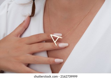 Personalized Silver Necklace On A Female Model Wearing A White Dress. Image For Ecommerce, Online Selling, Social Media, Jewelry Sale.