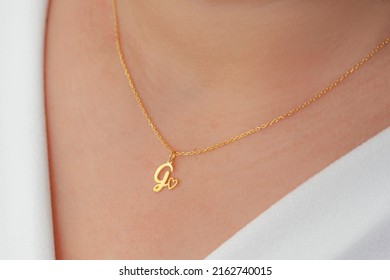 Personalized Silver Necklace On A Female Model Wearing A White Dress. Image For Ecommerce, Online Selling, Social Media, Jewelry Sale.