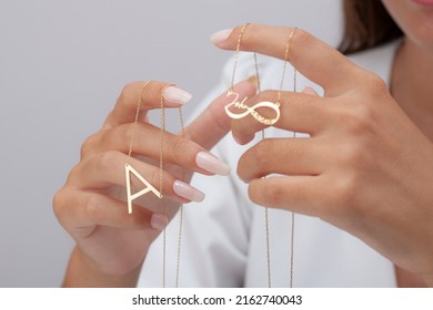 Personalized Silver Necklace On A Female Model Wearing A White Dress. Image For Ecommerce, Online Selling, Social Media, Jewelry Sale.