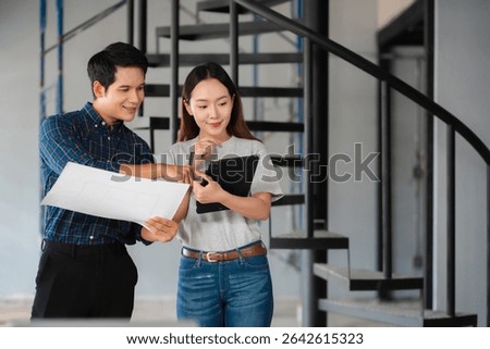 Person's engineer Hand Drawing Plan On Blue Print with architect equipment, Architects discussing at the table, team work and work flow construction concept.
