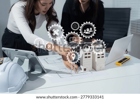 Person's engineer Hand Drawing Plan On Blue Print with architect equipment, Architects discussing at the table, team work and workflow construction concept.