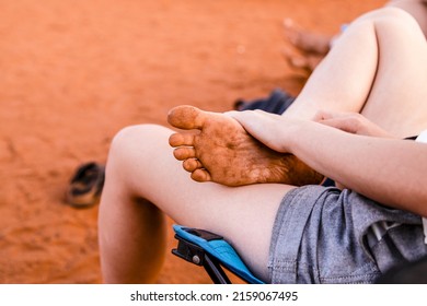 A Persons Foot Covered In Red Desert Sand In Northern Territory, Australia