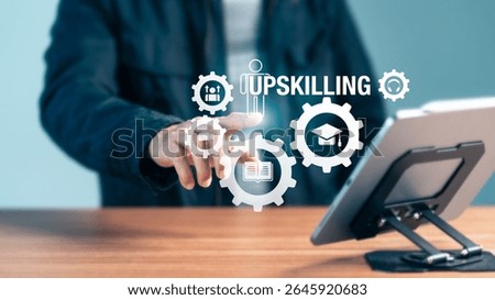 A person's hand interacts with "UPSKILLING" text and gear icons, alongside symbols for graduation, books, and individuals, depicting the process of continuous education
