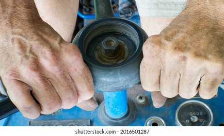 A Persons Hands Gripping A Steering Wheel