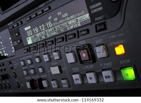 Perspective close-up of the front panel of the professional digital betacam video recorder.  Shallow dof. Displays, equalizer, buttons.
