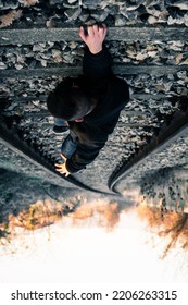 Perspective Concept Of A Person Hanging Over A Cliff