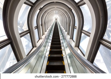 Perspective Escalators Stairway Inside Contemporary Blue Glass Business Centre, Concept Of Successful Career Elevation