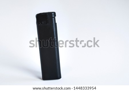 Perspective front shoot of angled full black lighter on white surface