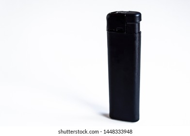 Perspective front shoot of vertical full black lighter on white surface