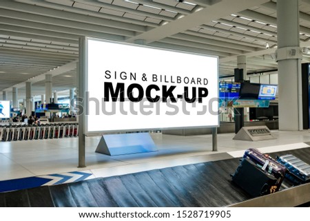 Perspective mock up blank large horizontal billboard with clipping path at baggage claim point in airport terminal, empty space for advertising or public information, advertisement concept