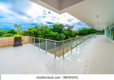 Perspective Of The Modern Glass And Steel Balcony, Deck, Patio, Promenade Railing. Exterior, Interior Design.