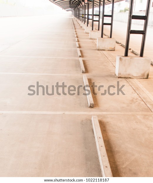 perspective of outdoor empty parking lot with\
steel tube structure and metal sheet\
roof