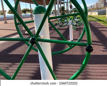 Perspective Of An Outdoor Gym Located In Front Of A Beach On A Sunny Day