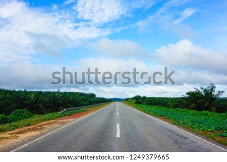 Perspective of a road with dramatic blue sky