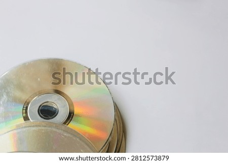 Perspective of Stack of old CD disc isolated in white background, realistic DVD, Blu-ray. Capturing vintage concept, rainbow reflection