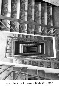 Perspective Stairs. Monochrome Twisted Vertigo Look At The Stairs Railing Leveling From Below, Patterns. 