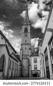 Perspective vertical view of the dome with the clock of the Zentralbibliothek (Central Library) under dramatic cloudy sky in Zurich, Switzerland. Black and white photography