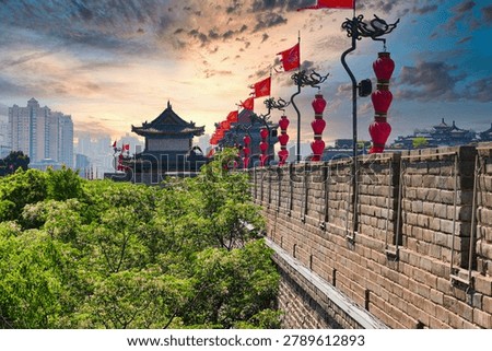 Perspective view of the ancient massive stone wall and watchtower adorned with red lanterns in Xi'an, Shaanxi, China