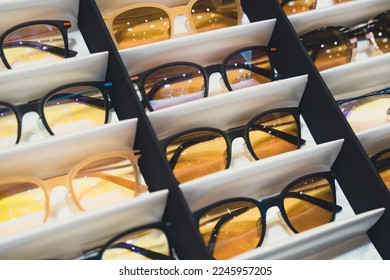 perspective view closeup of medical sunglasses in packaging boxes in store display shelf - Shutterstock ID 2245957205