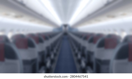 Perspective view down the aisle of an empty airplane cabin showing rows of seats on both sides. The lighting creates a tunnel effect.