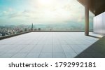 Perspective view of empty concrete tiles floor of rooftop with city skyline, Morning scene