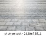 Perspective view of empty grey stone tile floor background with geometric pattern and texture suitable for product display or backdrop presentation.