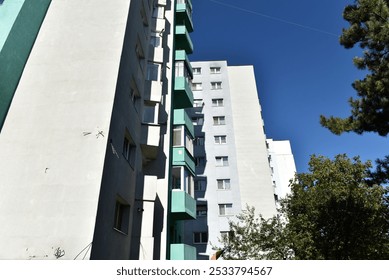 Perspective view of flat of blocks from Communist period, worn out concrete buildings in Eastern Europe - Powered by Shutterstock