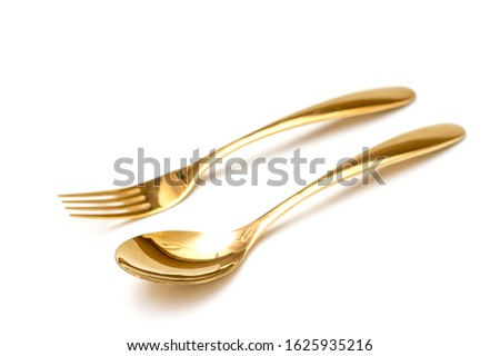 Perspective view of Golden Cutlery set isolated white background.