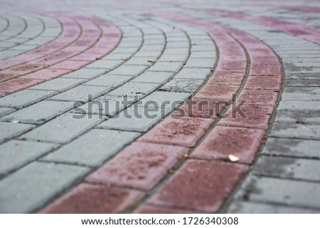 Perspective View Gray Brick Stone Pavement on The Ground for Street Road. Sidewalk, Driveway, Pavers, Pavement in Vintage Design Ground Flooring Square Pattern Texture Background for mock up