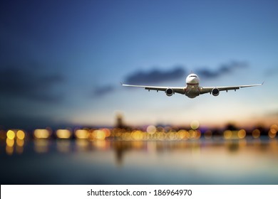 perspective view of jet airliner in flight with bokeh background - Shutterstock ID 186964970