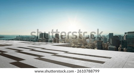 Perspective view of modern rooftop empty concrete floor and city view during sunrise. 