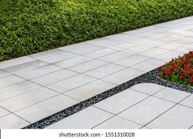 Perspective View Monotone Gray Brick Stone Pavement On The Ground For Street Road. Sidewalk Driveway Pavers Green Grass 