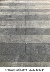 Perspective view of monotone Gray brick stone on the ground for sidewalk.
