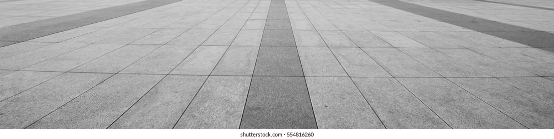 Perspective View Of Monotone Gray Brick Stone On The Ground For Street Road. Sidewalk, Driveway, Pavers, Pavement In Vintage Design Flooring Square Pattern Texture Background