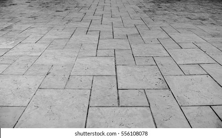 Perspective View of Monotone Grunge Cracked Gray Brick Marble Stone on The Ground for Street Road. Sidewalk, Driveway, Pavers, Pavement in Vintage Design Flooring Square Pattern Texture Background