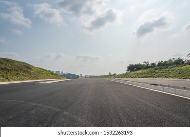 Perspective view of new asphalt road and sky in modern city suburb - Shutterstock ID 1532263193