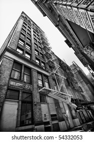 Perspective View Of NYC Building Exterior With Fire Escape, Black And White.