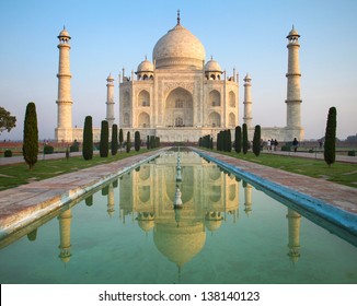 A perspective view on Taj Mahal mausoleum with reflection in water. Agra, India.