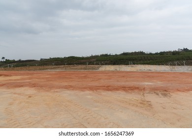 Perspective view of open and level dirt ground