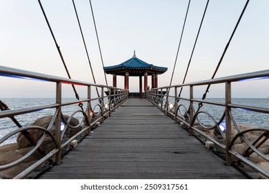 perspective view of the suspension bridge at the seaside - Powered by Shutterstock